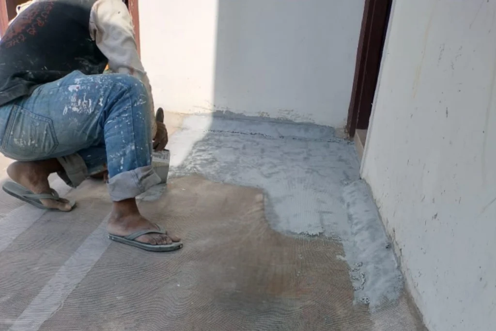 Waterproofing mesh layer installation for crack protection and durability